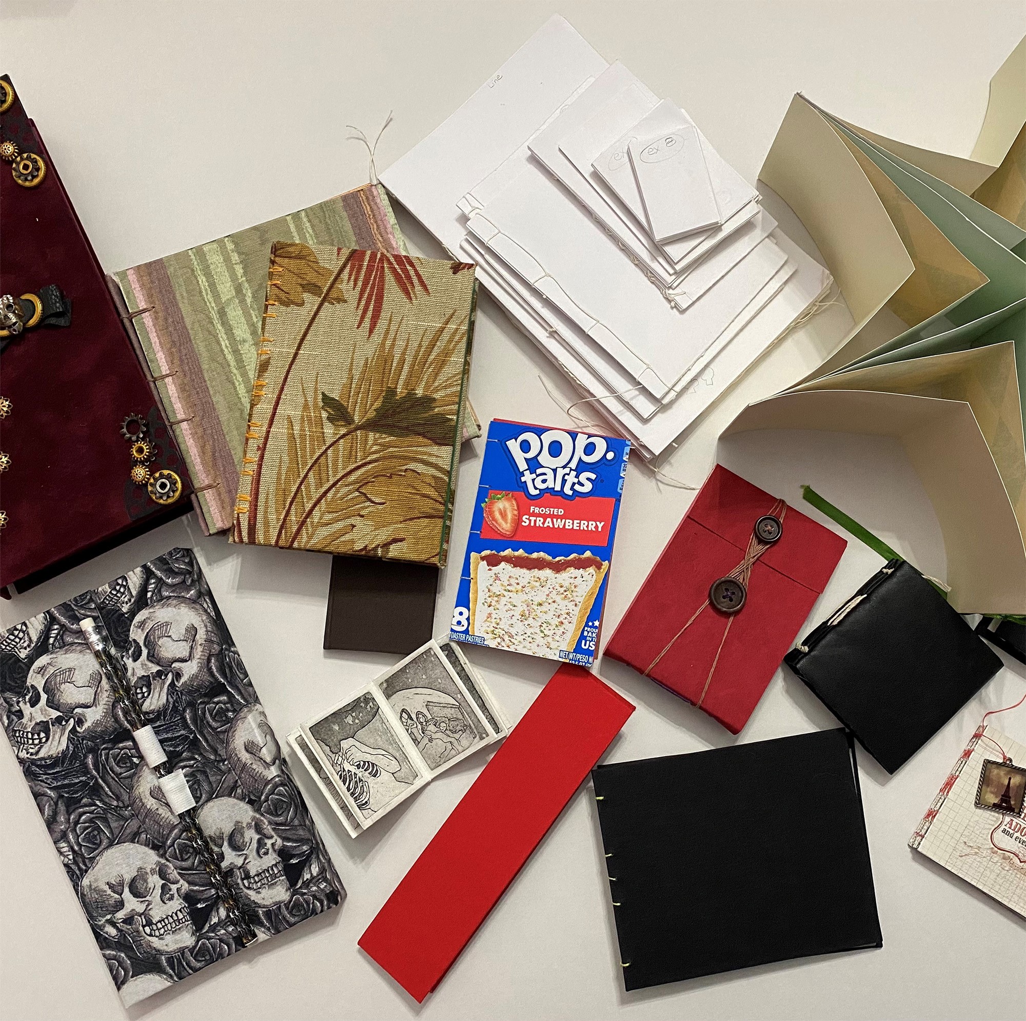 Display of various handcrafted books by bookbinding.